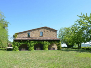 Stone house in the green rolling hills of the Apennines with garden